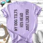 Purple t-shirt with black text reading "MY DOG TILTS HIS HEAD JUST LIKE YOU."