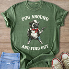 Green t-shirt with a pug wearing a cowboy hat and holding a gun.