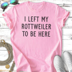 Pink t-shirt with "I left my Rottweiler to be here" text.