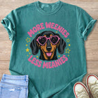 Teal t-shirt with graphic of dachshund wearing heart sunglasses and text "More Weenies Less Meanies".