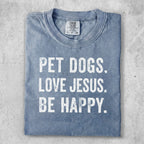 Blue t-shirt with "PET DOGS. LOVE JESUS. BE HAPPY." text.
