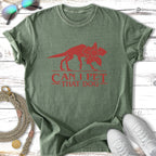Green t-shirt with red graphic of a dinosaur and text "CAN I PET THAT DOG".