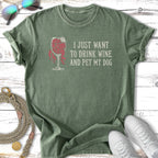 Green t-shirt with "I JUST WANT TO DRINK WINE AND PET MY DOG" text.
