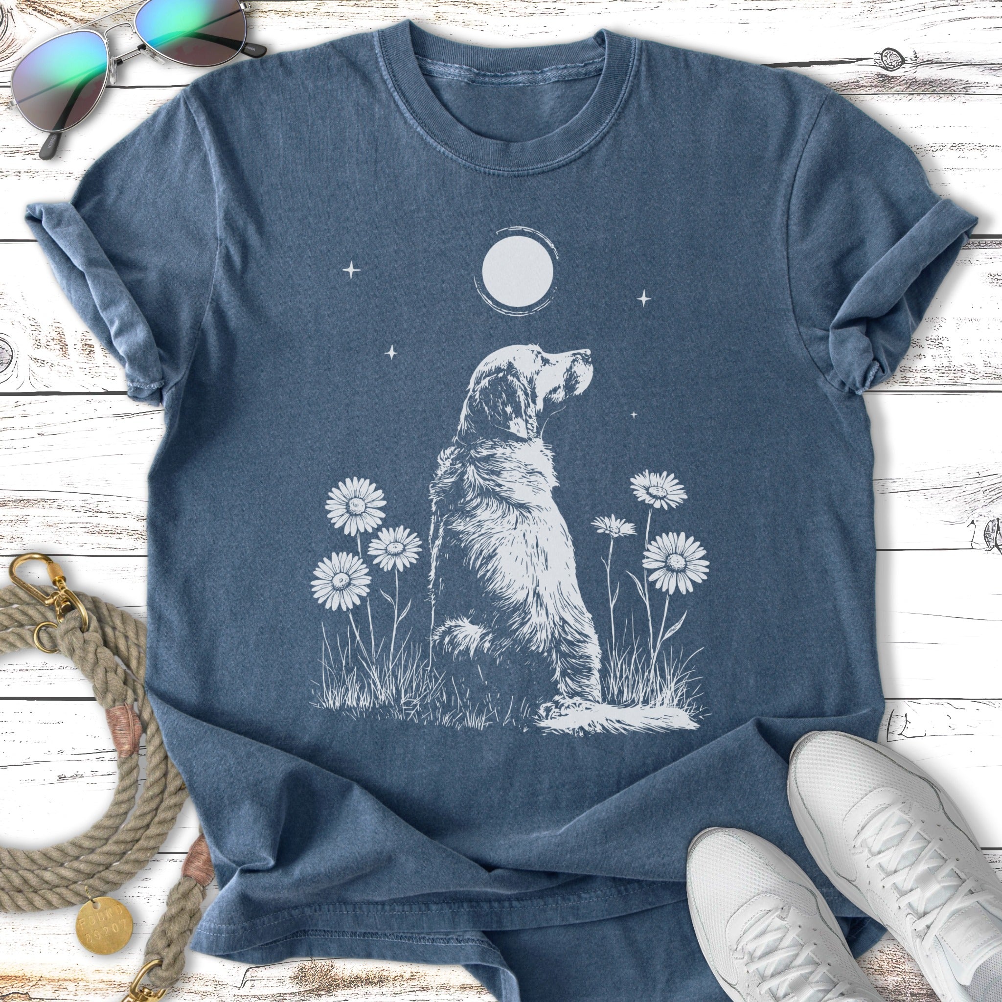Golden retriever sitting in grass with daisies under a full moon.