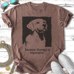 T-shirt with a distressed black and white dog portrait and "because therapy is expensive."