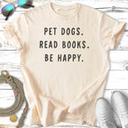 Cream t-shirt with "PET DOGS. READ BOOKS. BE HAPPY." text.