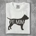 White t-shirt with "PIT MOM" in a dog silhouette.