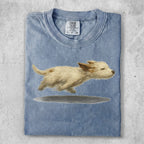 Light blue Comfort Colors t-shirt with a watercolor painting of a small tan dog running.