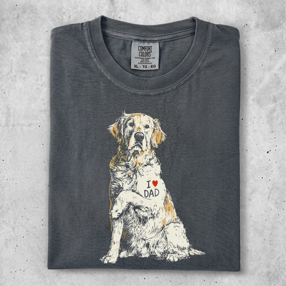 Golden Retriever wearing "I ❤️ DAD" heart on chest.
