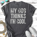 Dark gray t-shirt with white text "MY DOG THINKS I'M COOL".