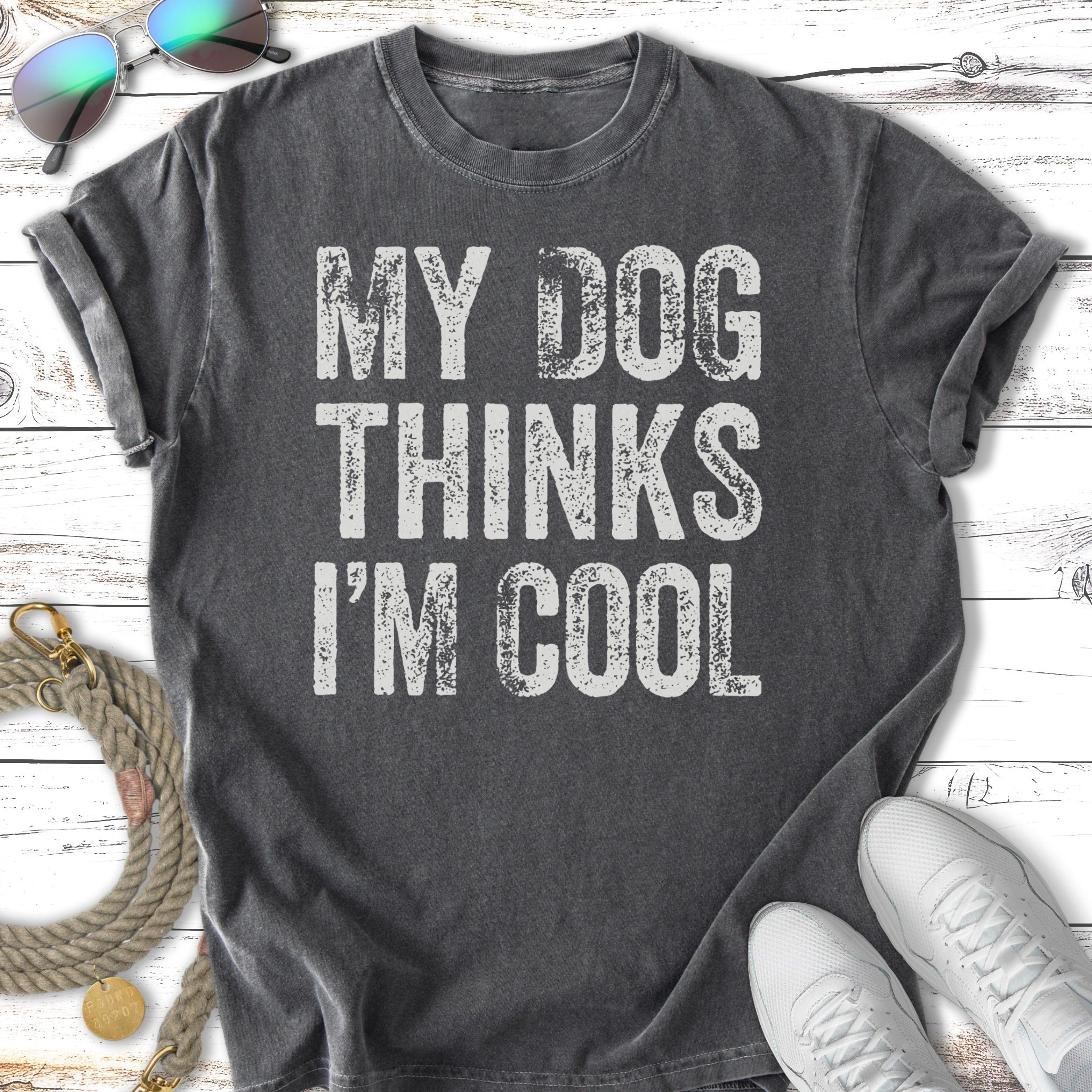 Dark gray t-shirt with white text "MY DOG THINKS I'M COOL".