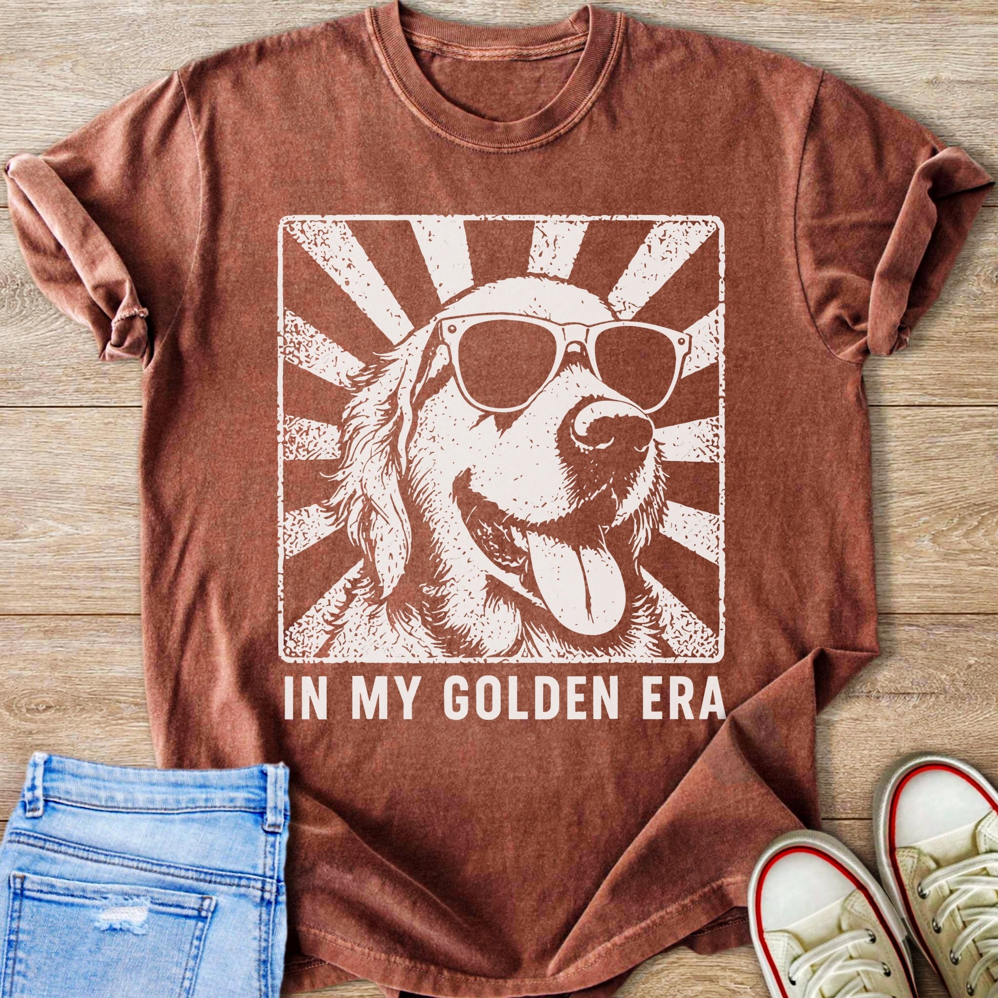 T-shirt with white graphic of golden retriever wearing sunglasses and text "IN MY GOLDEN ERA"