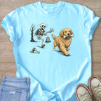 Skeleton running from a golden retriever holding a bone on a light blue t-shirt.