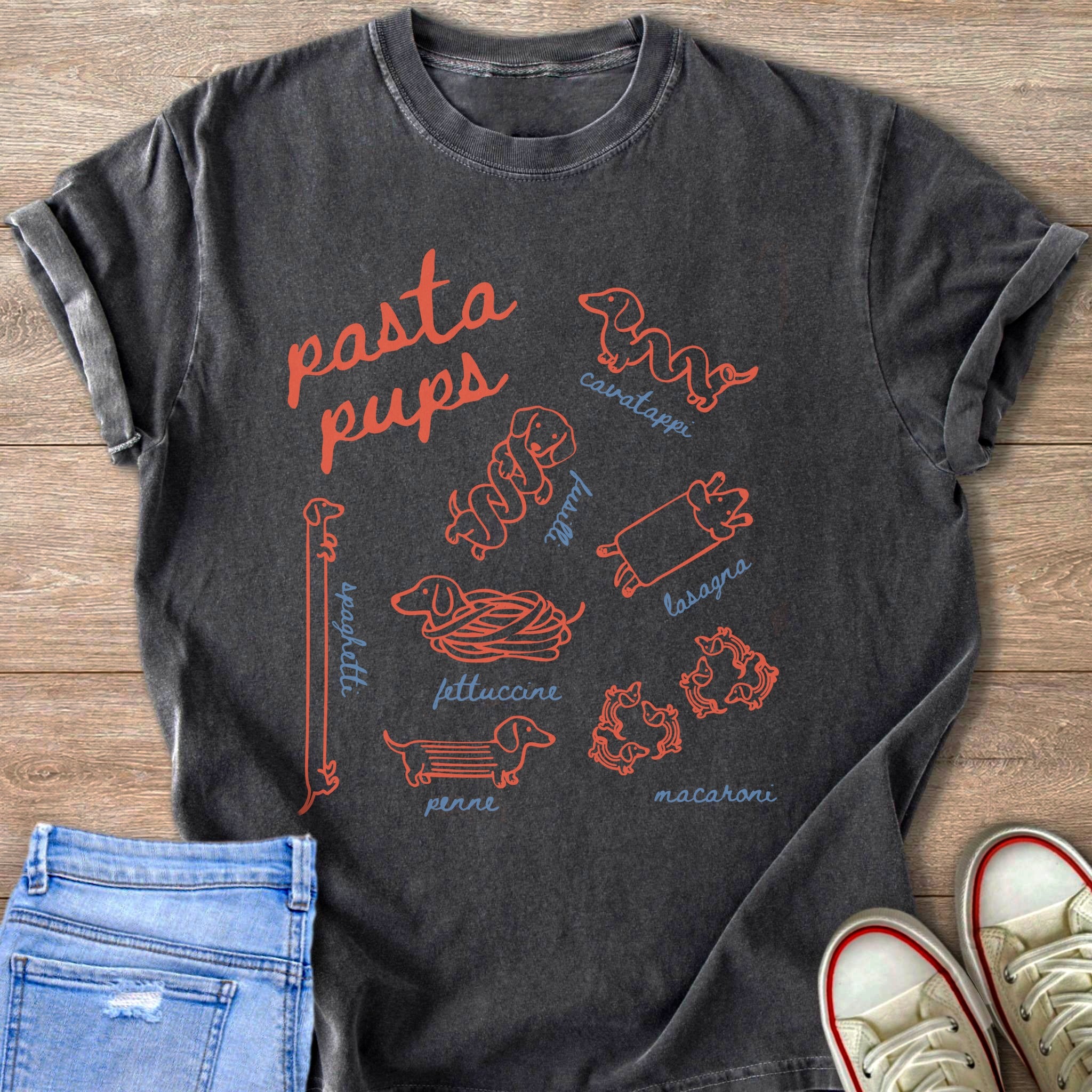 Dark gray t-shirt with "pasta pups" text and dachshunds shaped like pasta.