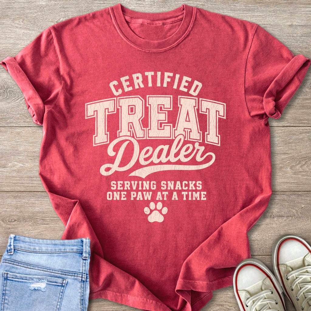 Red t-shirt with "Certified Treat Dealer" text and a paw print.