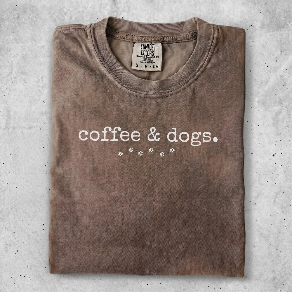 Brown Comfort Colors t-shirt with "coffee & dogs." and paw print graphic.