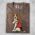 Beagle dog wearing a red shirt with an "I Love Mom" tattoo.
