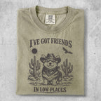 T-shirt with cowboy corgi, cacti, and text "I'VE GOT FRIENDS IN LOW PLACES".