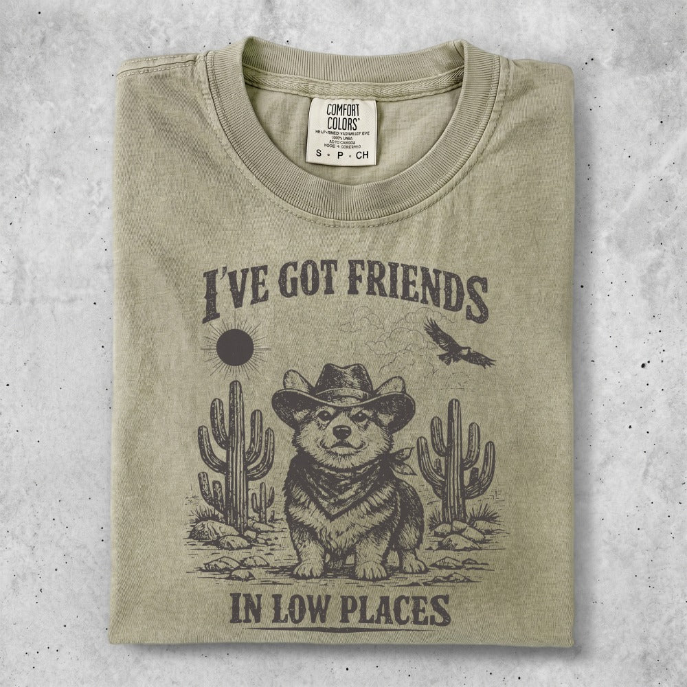 T-shirt with cowboy corgi, cacti, and text "I'VE GOT FRIENDS IN LOW PLACES".