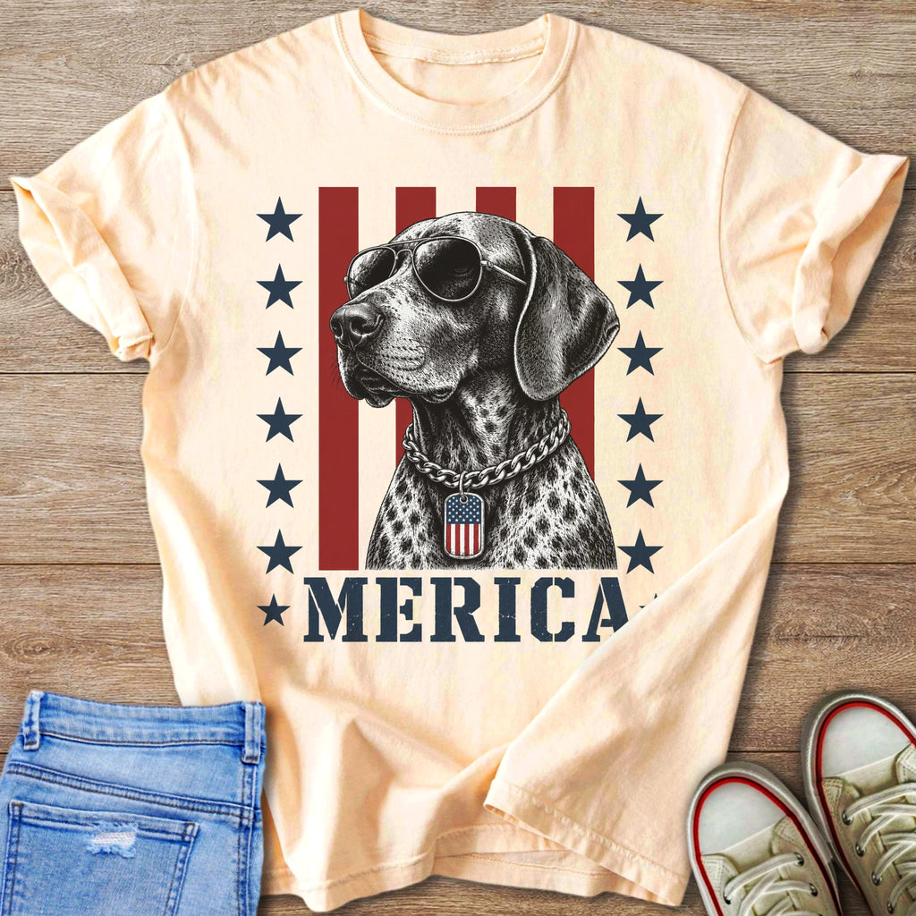Sleek dog wearing sunglasses and an American flag tag, with "MERICA" below.