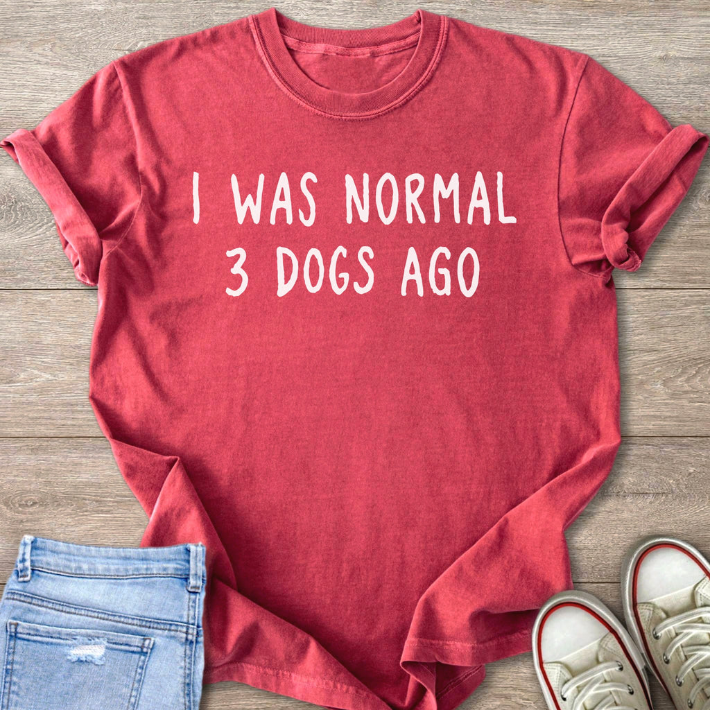 Red t-shirt with white text saying "I WAS NORMAL 3 DOGS AGO".
