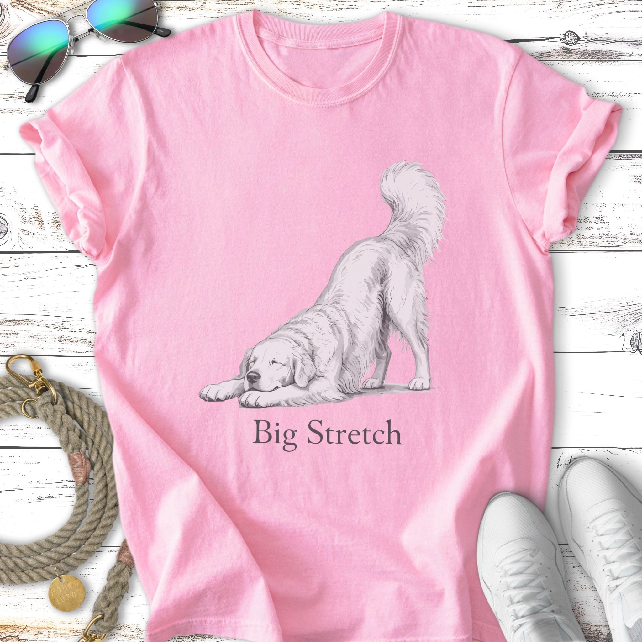 Pink t-shirt with a white dog in a big stretch pose and text "Big Stretch".