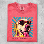 Golden Retriever wearing sunglasses on vibrant sunburst background, "IN MY GOLDEN ERA" text.