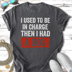 Dark grey t-shirt with "I USED TO BE IN CHARGE THEN I HAD A DOG" text.