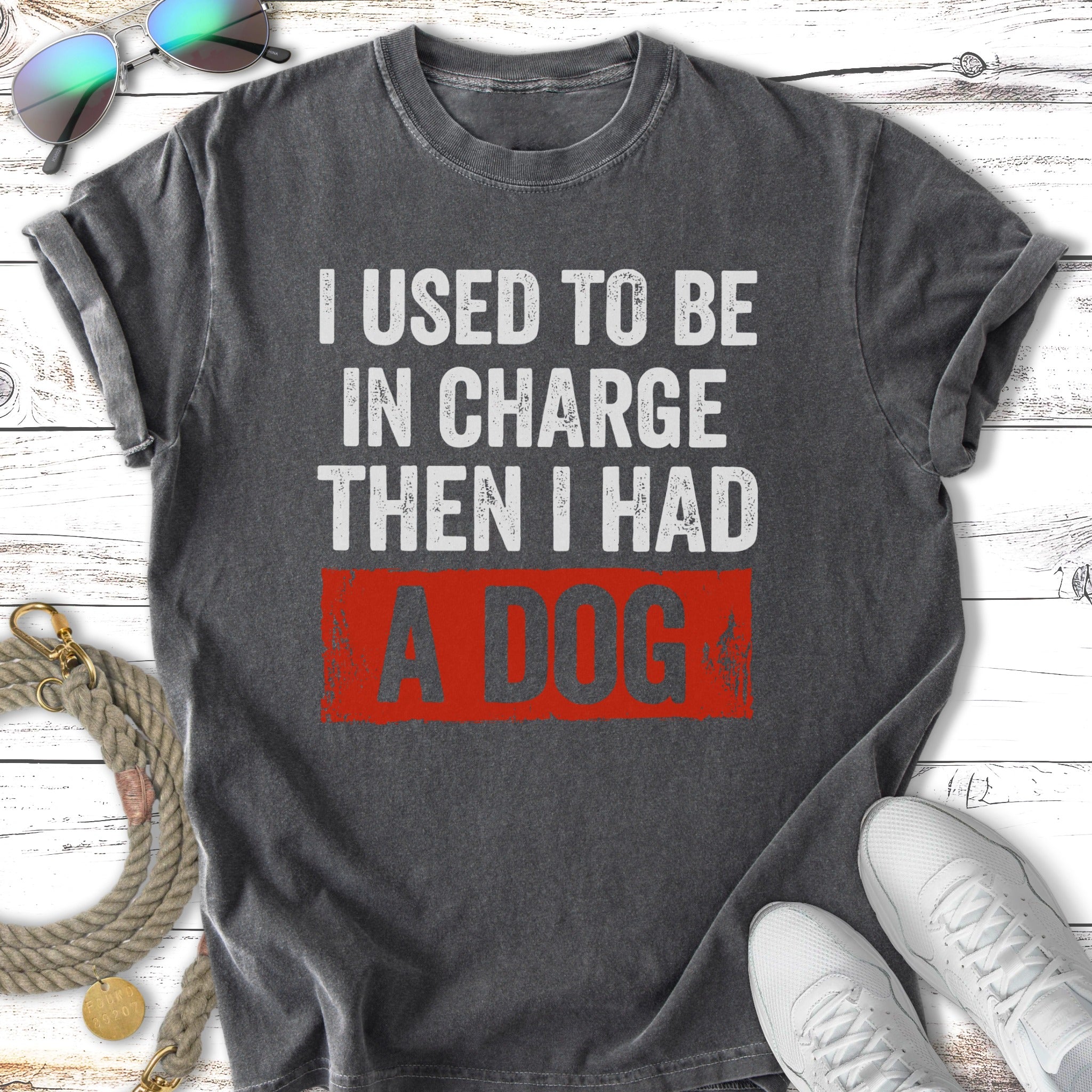 Dark grey t-shirt with "I USED TO BE IN CHARGE THEN I HAD A DOG" text.