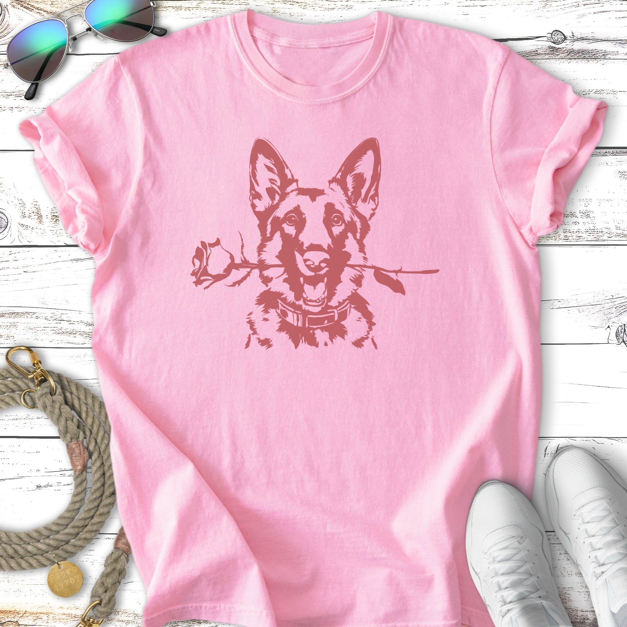 Pink t-shirt with a German Shepherd dog holding a rose in its mouth.