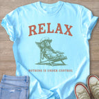 Light blue t-shirt with text "RELAX" and a drawing of a dog on a lounge chair.