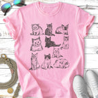 Nine different kittens sketched on a pink t-shirt.
