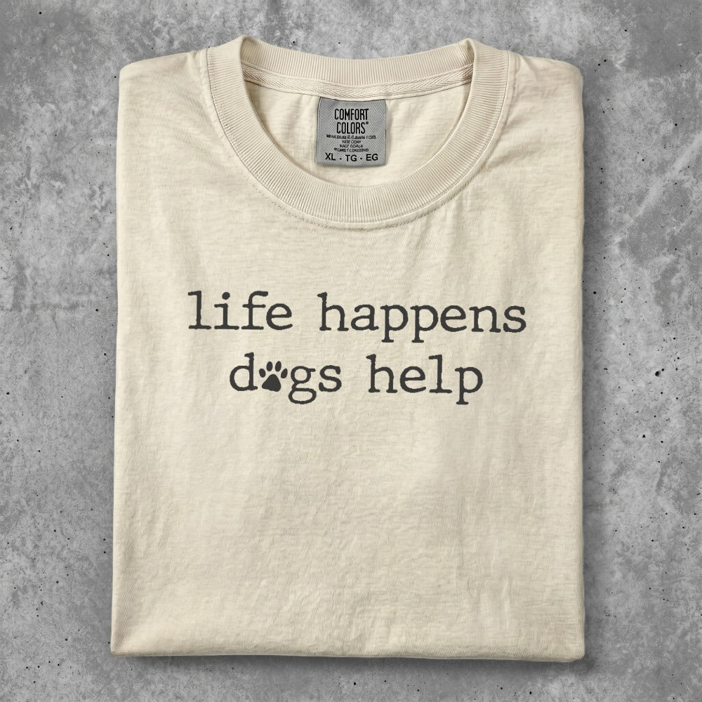 Cream t-shirt with "life happens dogs help" and paw print graphic.