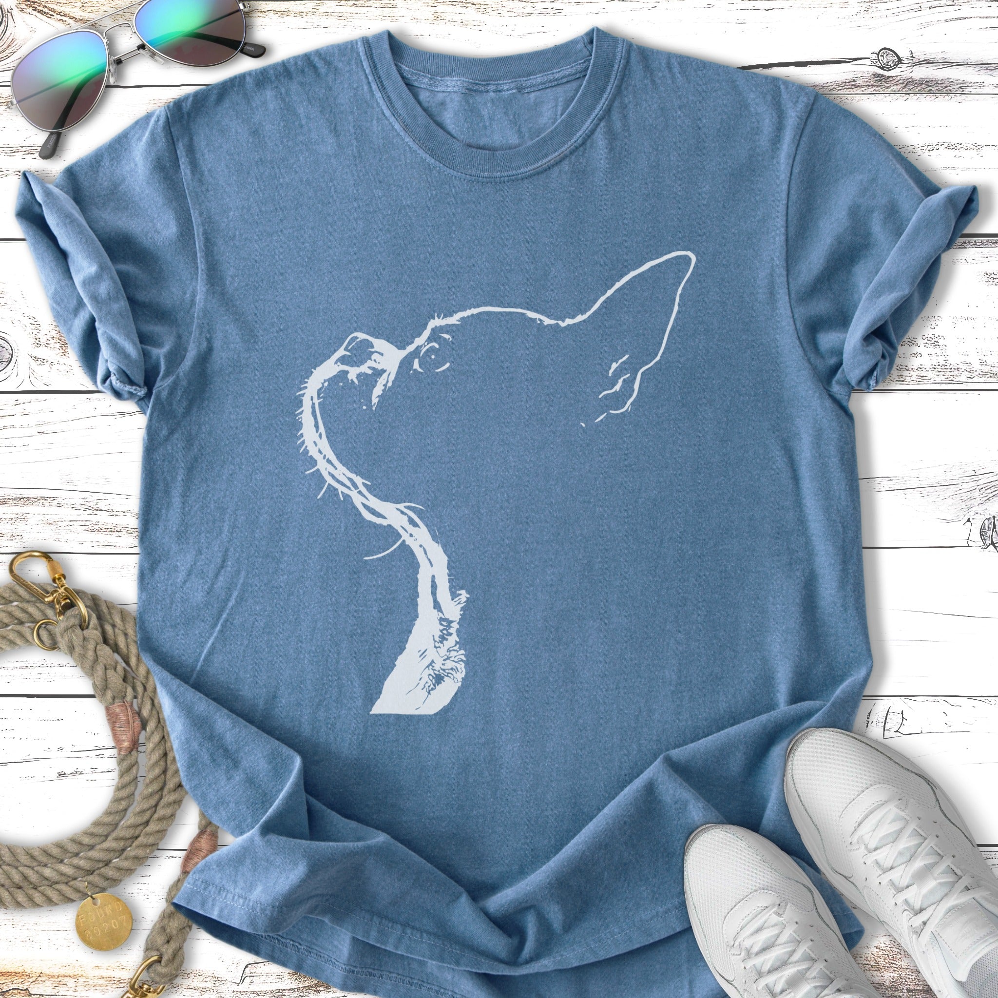Blue t-shirt with a white outline graphic of a dog's head.