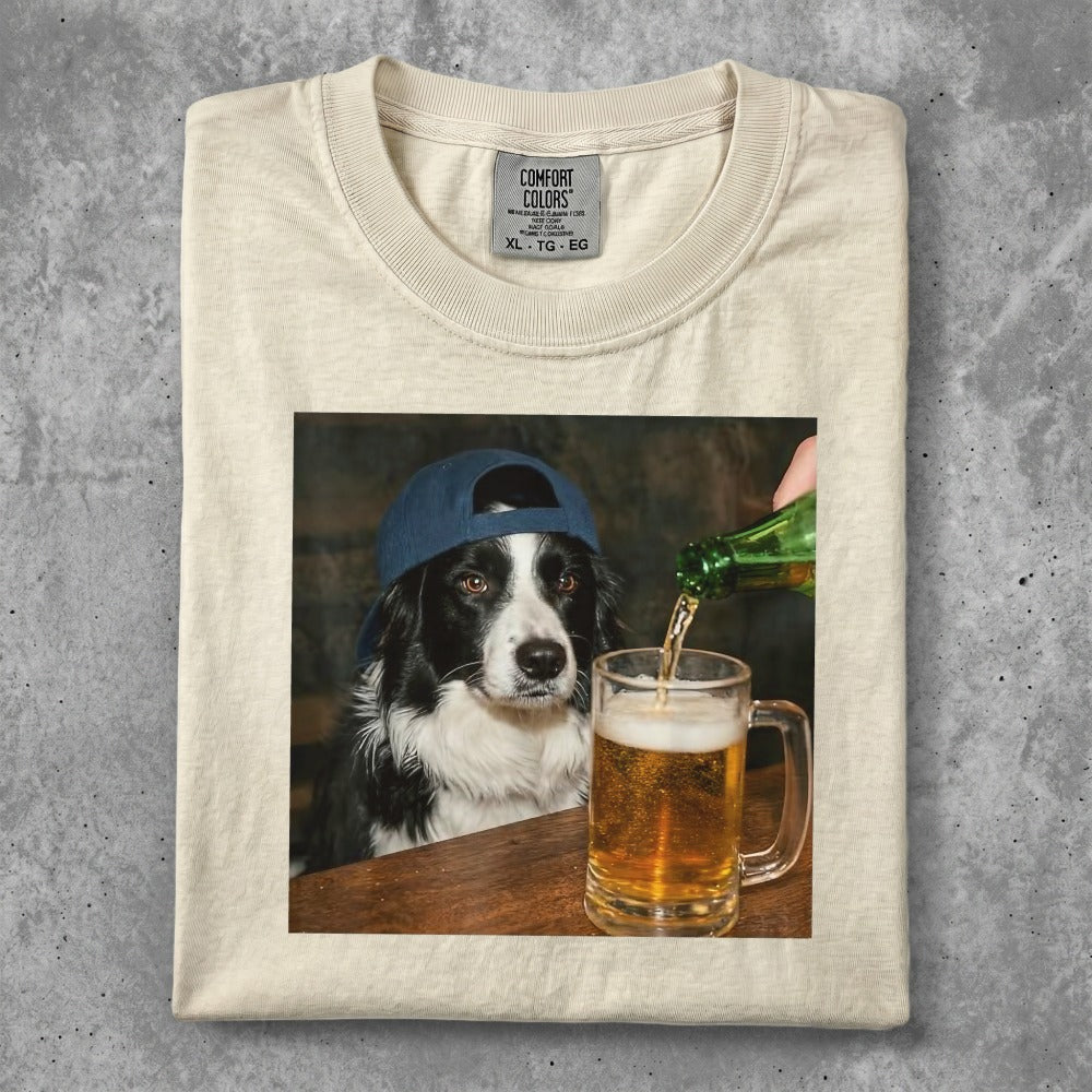 Border collie in a baseball cap with beer being poured into its mug.