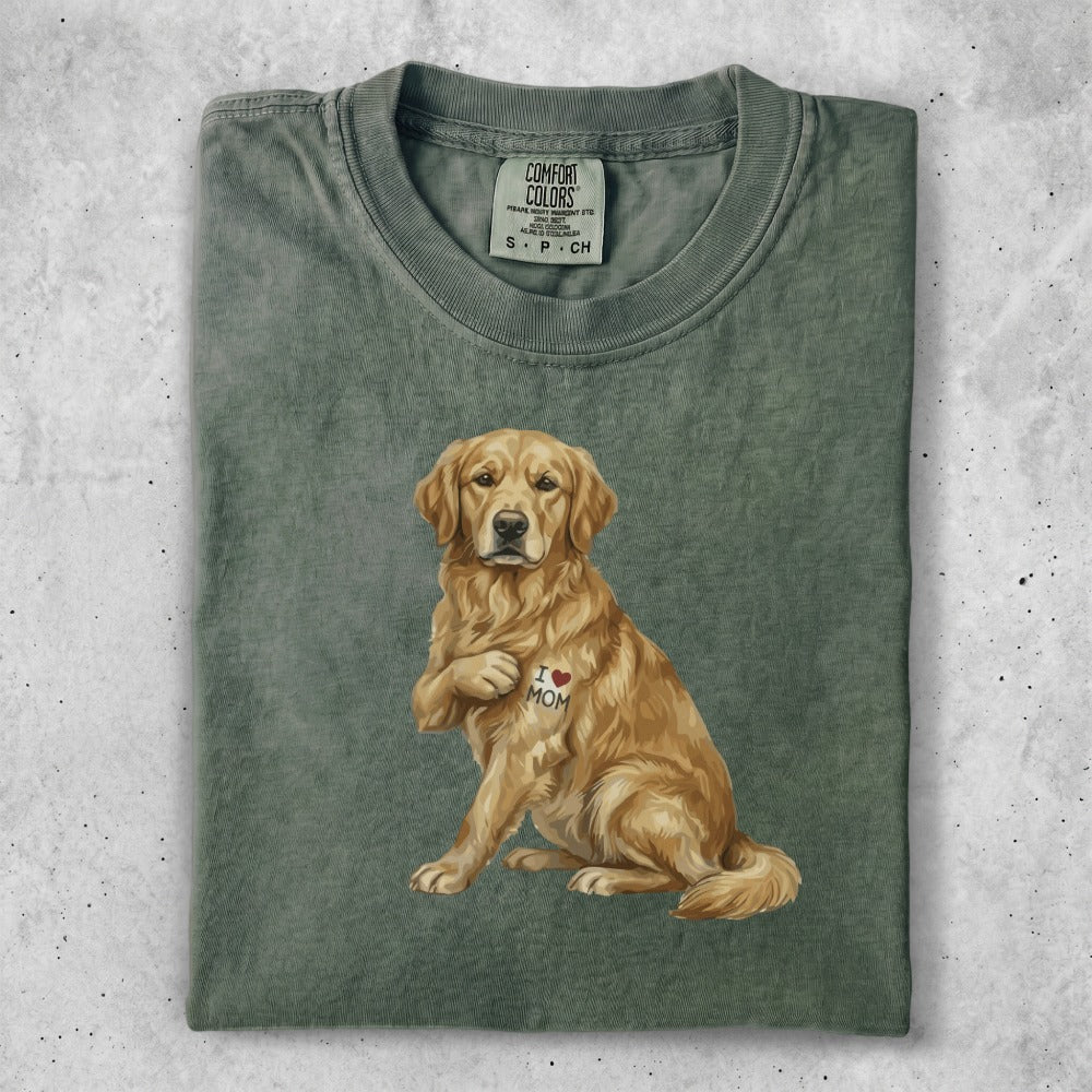 Golden retriever wearing a t-shirt with an "I Love Mom" heart graphic.