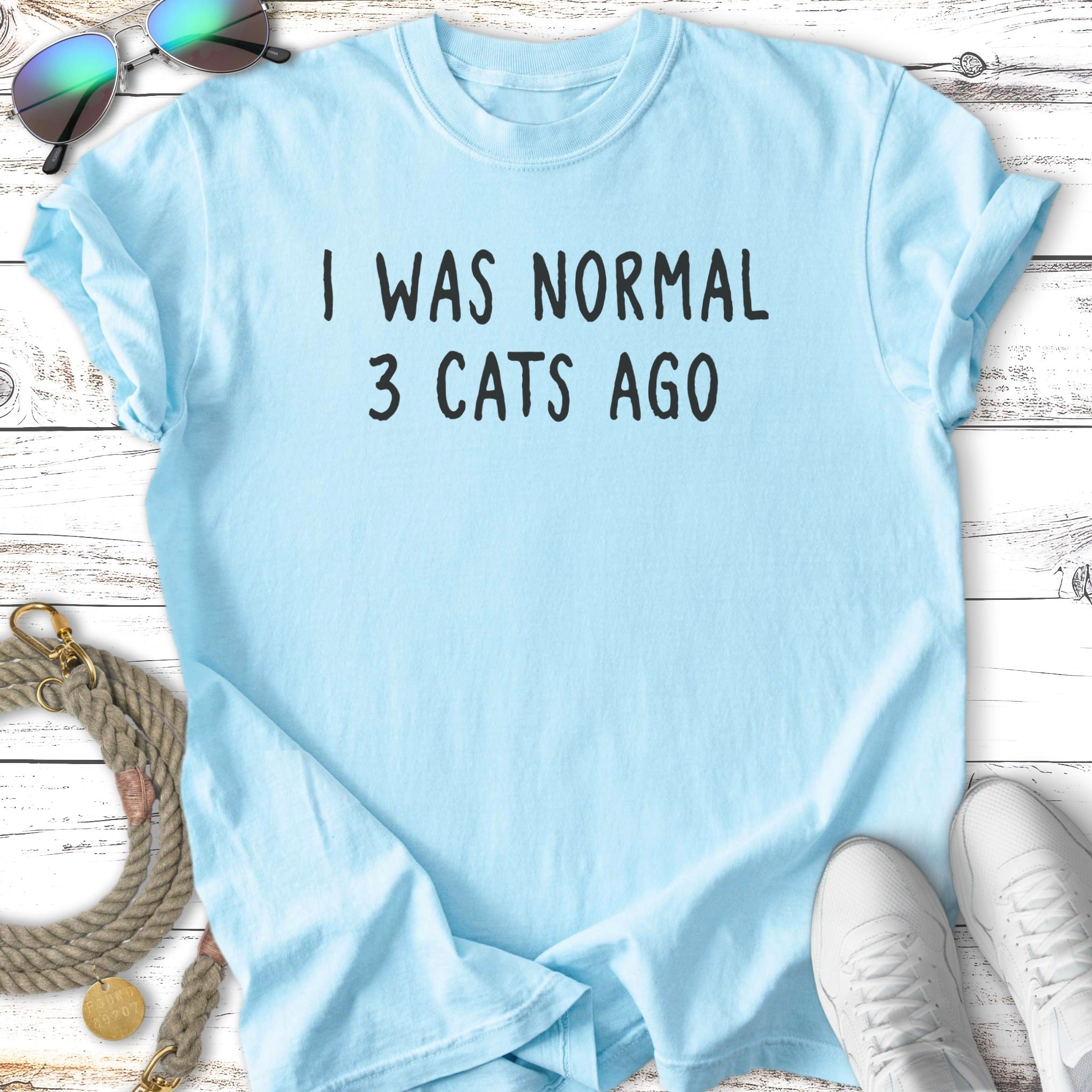 Light blue t-shirt with "I WAS NORMAL 3 CATS AGO" text.