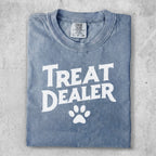 Blue t-shirt with "Treat Dealer" and a paw print graphic.