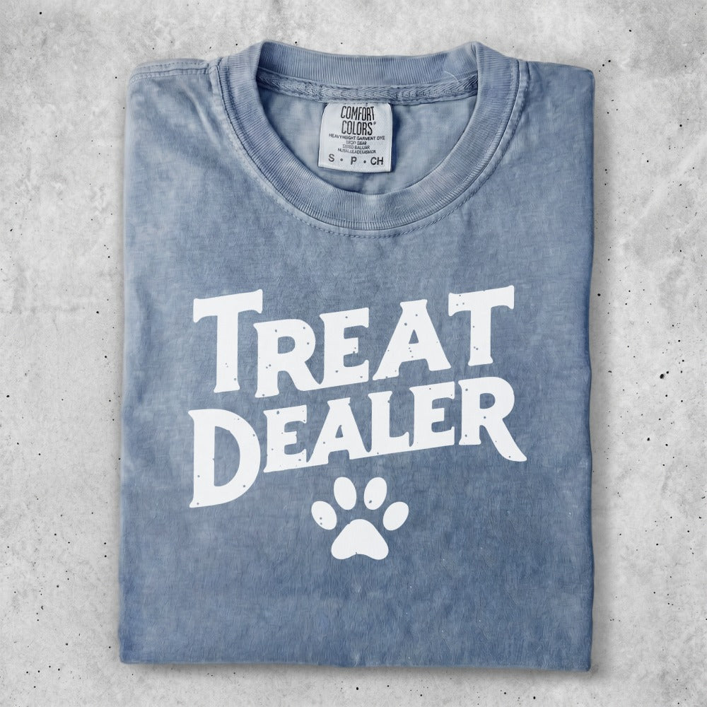 Blue t-shirt with "Treat Dealer" and a paw print graphic.