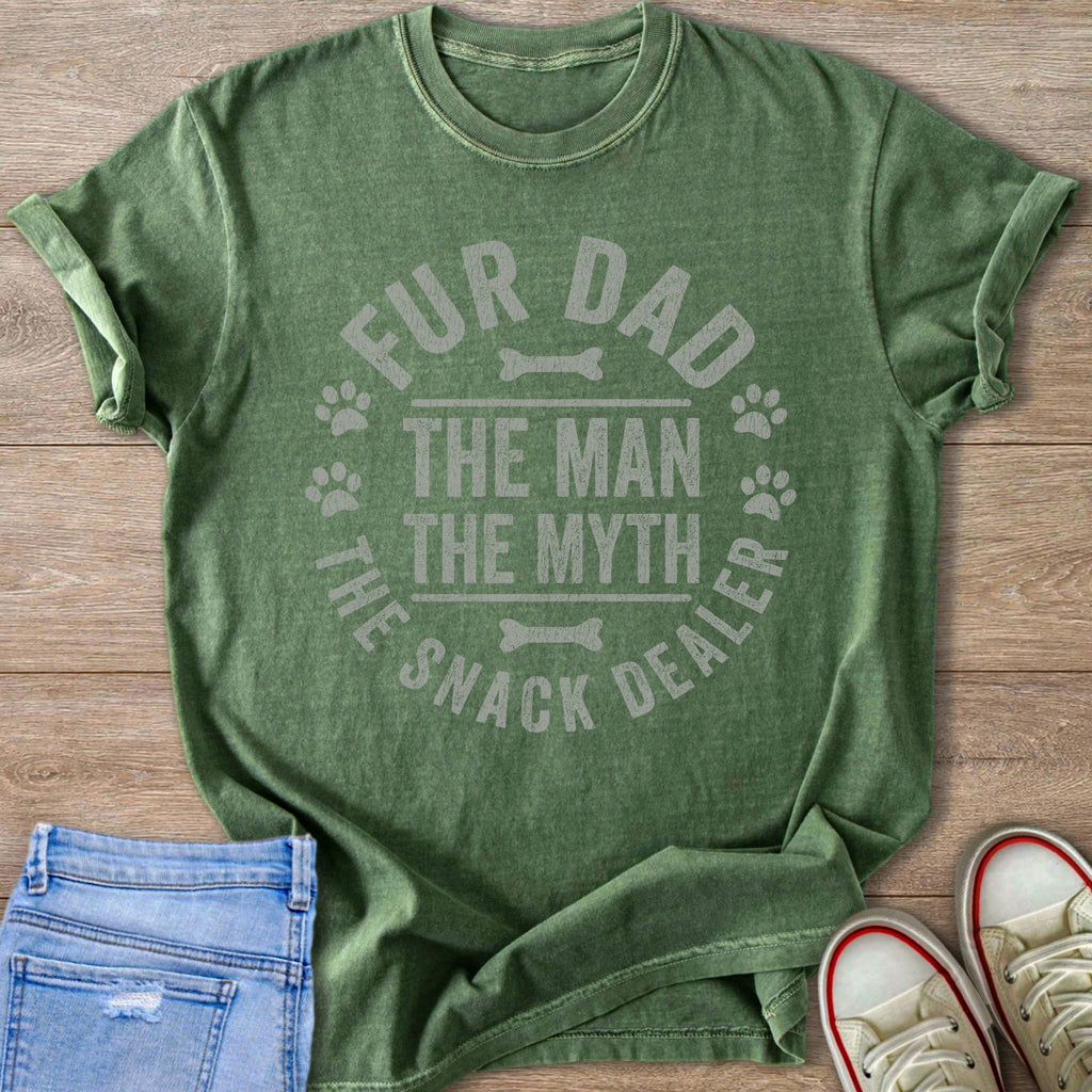 Green t-shirt with text "Fur Dad The Man The Myth The Snack Dealer" and paw prints.