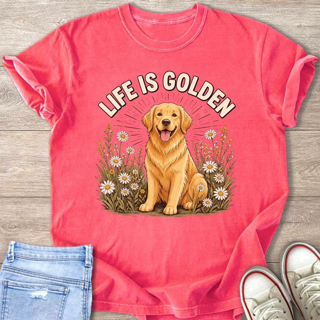 Golden retriever sits in a field of daisies with text "LIFE IS GOLDEN".