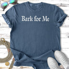 Blue t-shirt with "Bark for Me" text, dog leash, and sneakers.