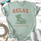 Light green t-shirt with dog relaxing in a chair, "RELAX NOTHING IS UNDER CONTROL" text.