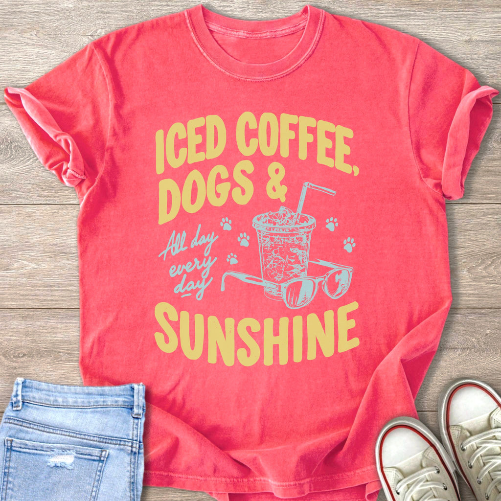 Coral t-shirt with graphic text "Iced Coffee, Dogs & All Day Every Day Sunshine."