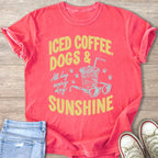 Coral t-shirt with graphic text "Iced Coffee, Dogs & All Day Every Day Sunshine."