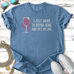 Blue t-shirt with "I just want to drink wine and pet my dog" text.