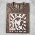 Golden Retriever wearing sunglasses with sunburst and "In My Golden Era" text.