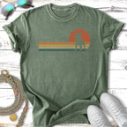 Distressed t-shirt with vintage sunset and dog silhouette graphic.