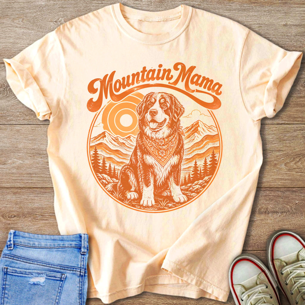 T-shirt with "Mountain Mama" text and dog in mountainous landscape graphic.