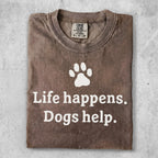 Brown t-shirt with "Life happens. Dogs help." and paw print graphic.